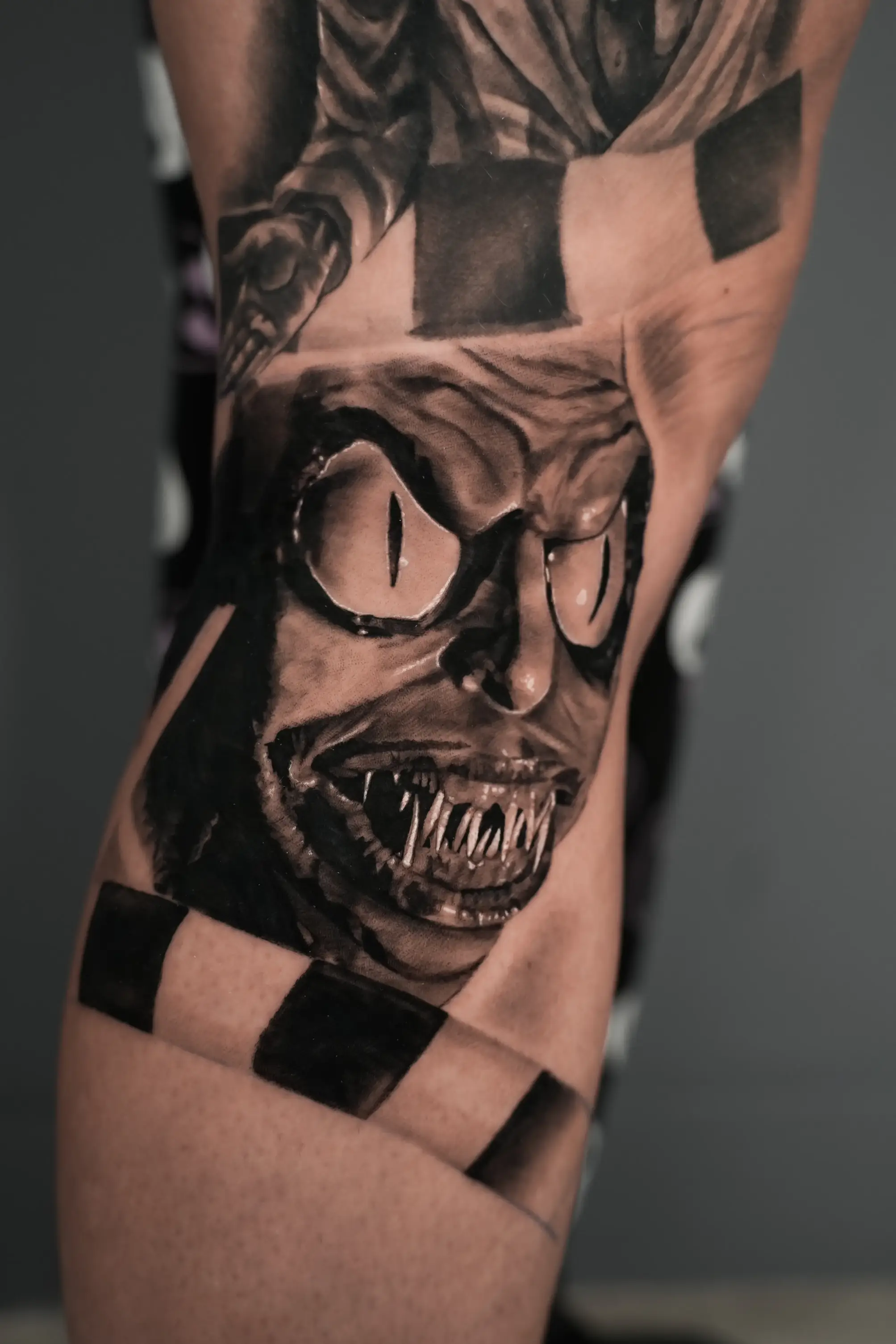 Creepy realistic Beetlejuice tattoo by Devin
