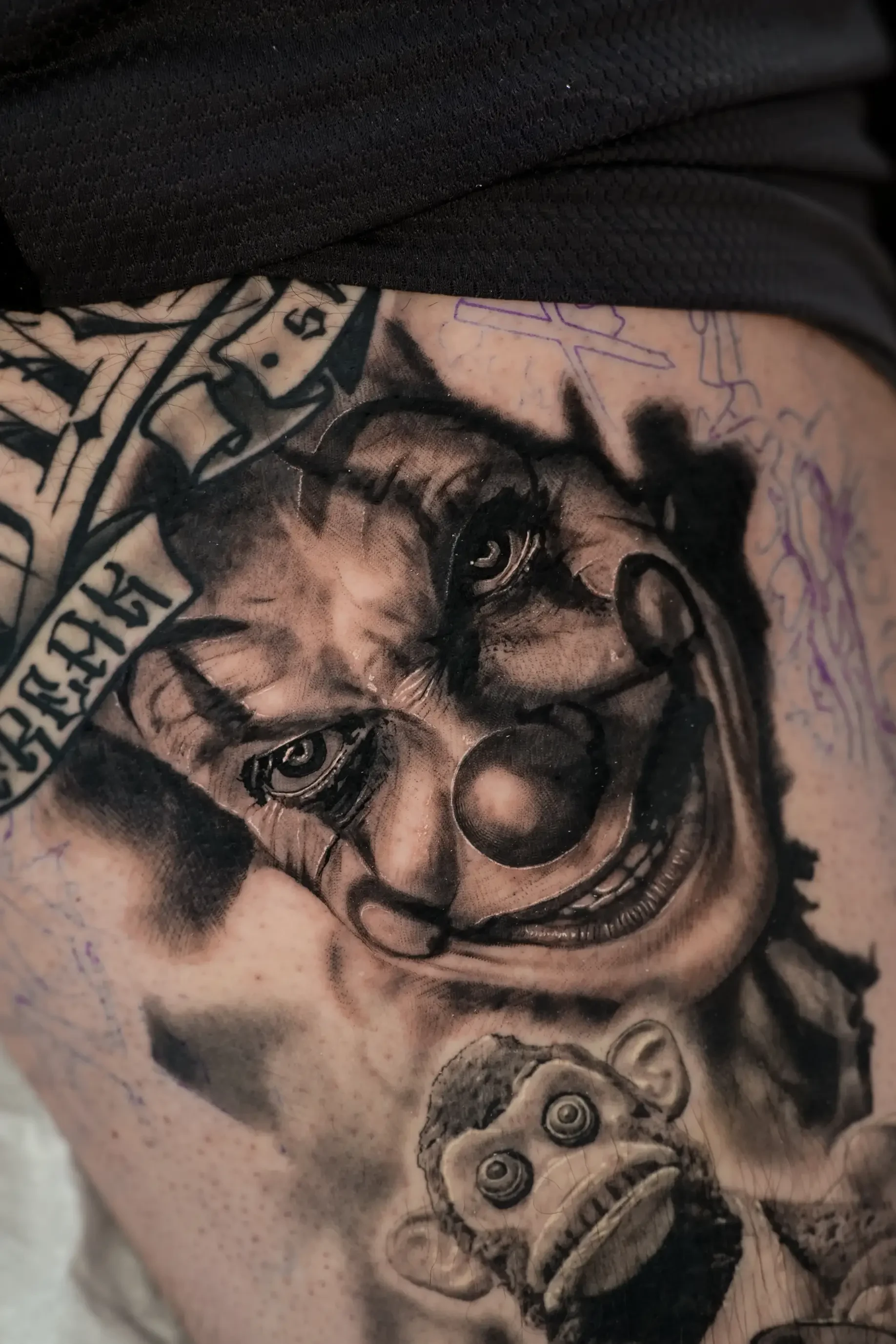 Creepy realistic Pennywise tattoo by Devin